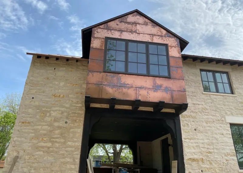 Copper metal panel facade on a stone building for Metal Roof Coating in Pinecrest